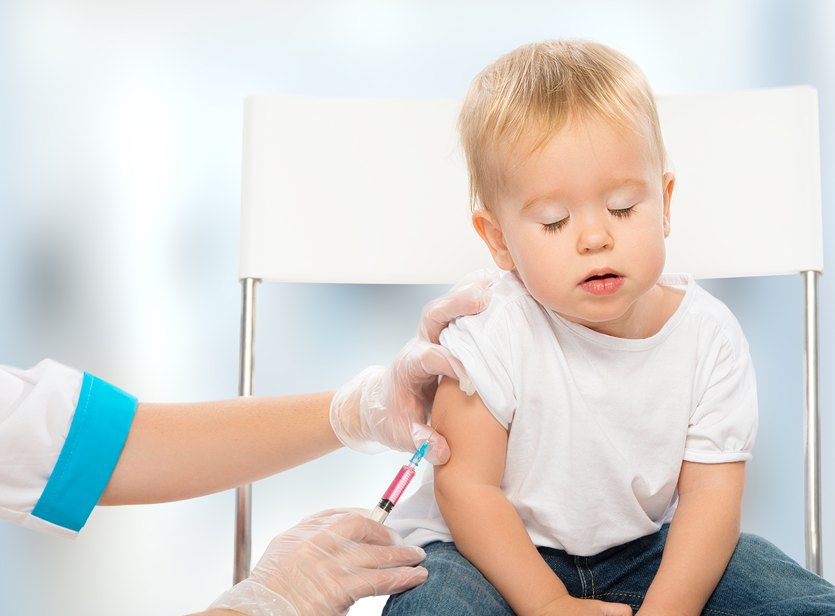 Orphan-Drugs, baby getting a shot from a doctor